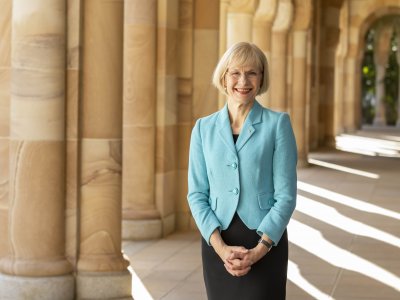 UQ Vice-Chancellor stands in the cloisters of the Great Court at the St Lucia campus.